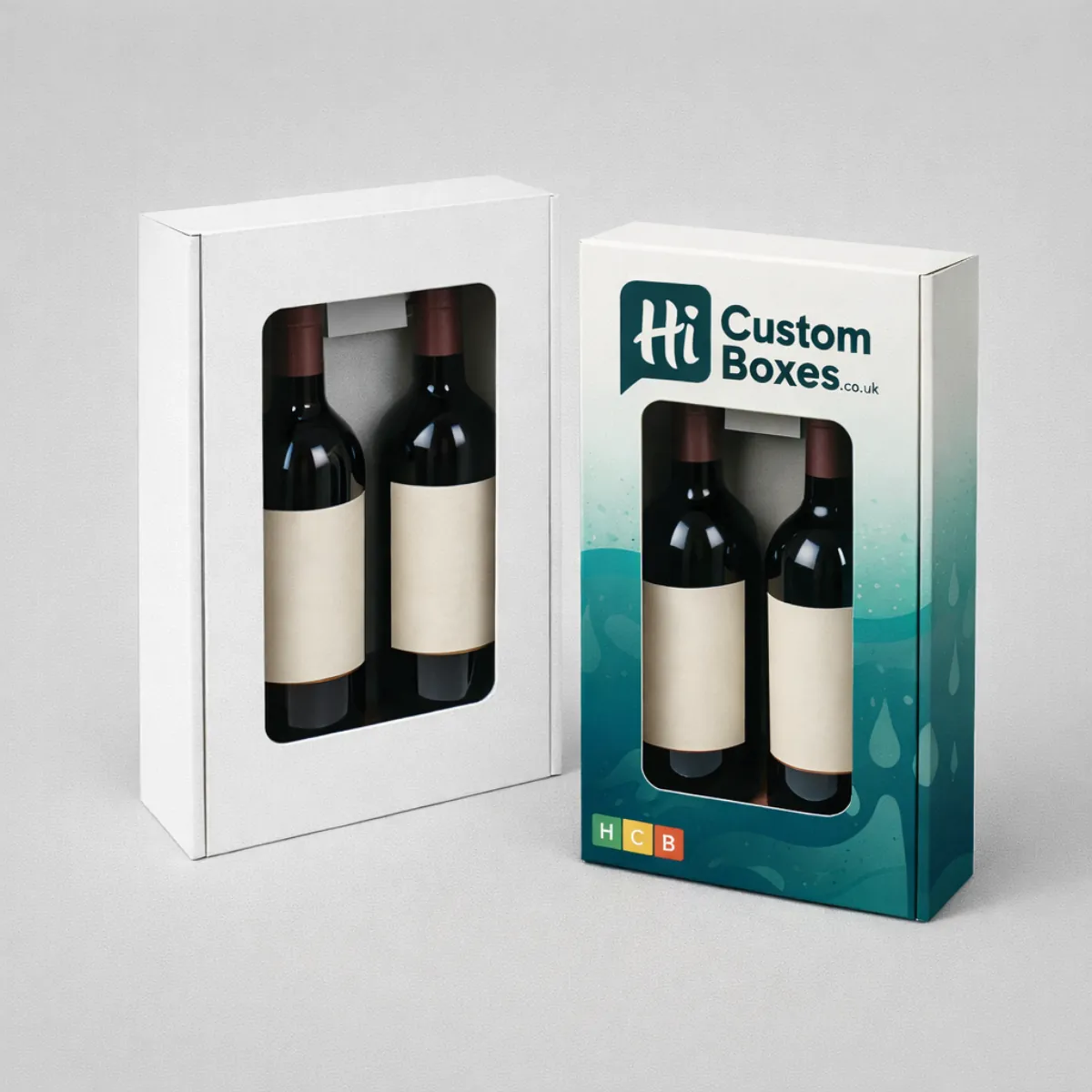 Two rectangular presentation boxes with large windows- each containing two wine bottles with cream-coloured labels- class=